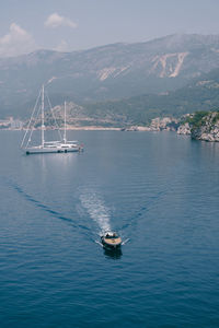 High angle view of sailboat sailing on sea against sky