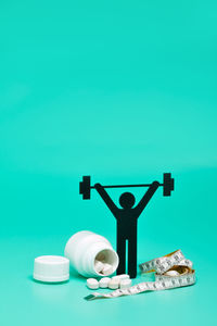 View of figurine against blue background