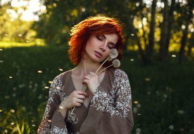 Beautiful young woman looking at camera