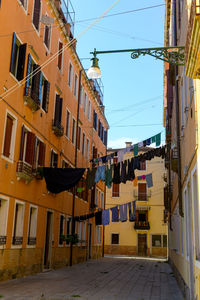 Typical city corner with ancient colorful buildings drying clothes on a clothes-line in outdoor 