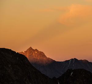 Scenic view of mountains against dramatic sky