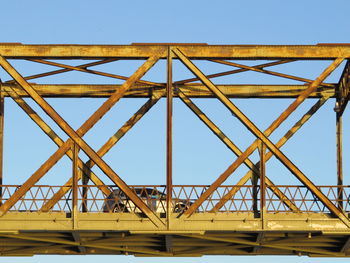 Suspension bridge against clear blue sky