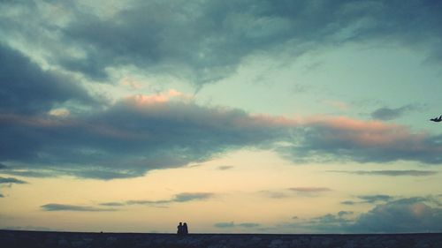 Scenic view of sea against sky at sunset
