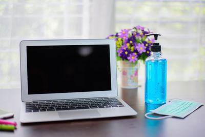 Flower vase on table at home