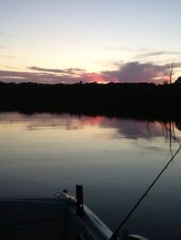 Scenic view of lake at sunset