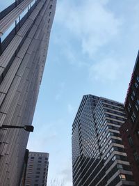 Low angle view of modern buildings against sky