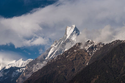 Scenic view of snow covered mountain against sky