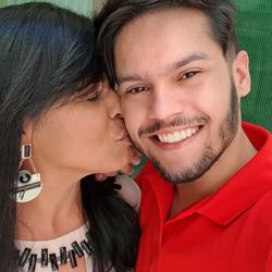 Close-up of woman kissing man