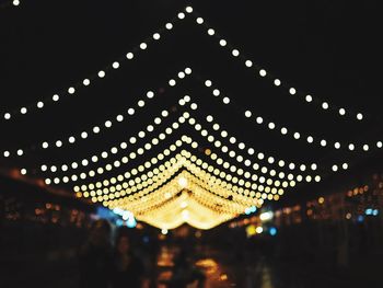 Low angle view of illuminated building at night
