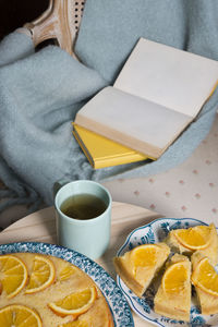 Reading and hot tea and orange pie, cozy vibes, warm home atmosphere,