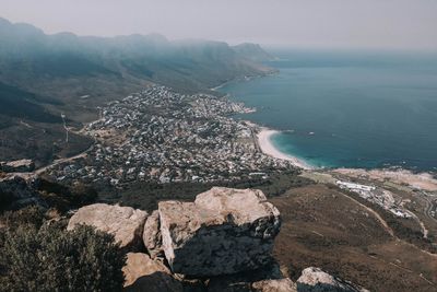 Aerial view of sea and mountain against sky