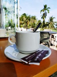 Close-up of coffee cup on table