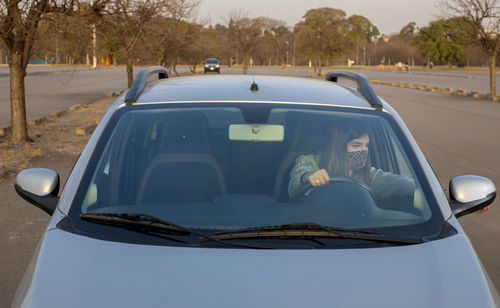 Close-up of car on road