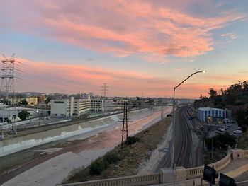 High angle view of city street against sky during sunset