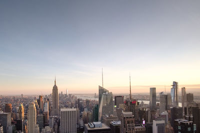 Aerial view of city buildings during sunset