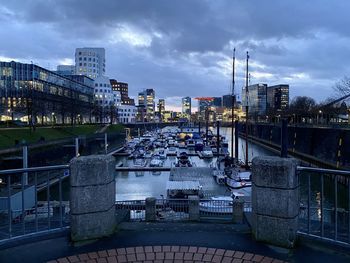 High angle view of bridge over river amidst buildings in city