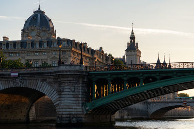 Arch bridge over river against sky. pont notre-dame, paris - france, 31. may 2019.