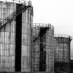 Low angle view of factory against sky