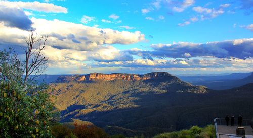 Scenic view of mountains against cloudy sky