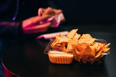 Nachos with dip on table