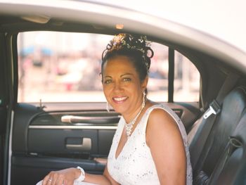 Portrait of smiling woman sitting in car