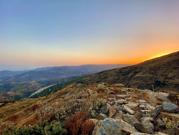 Scenic view of landscape against sky during sunset