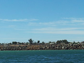 Scenic view of sea against blue sky