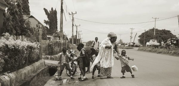 Mother with children on street