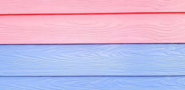 Full frame shot of pink and blue wooden table