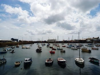 Boats moored at harbor