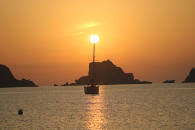 Scenic view of sea against orange sky during sunset