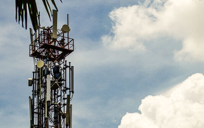 Low angle view of communications tower against sky