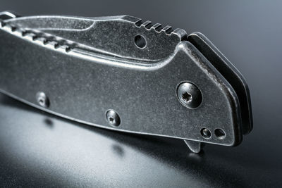 Close-up of utility knife on table