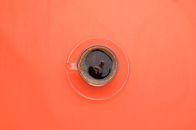 Directly above shot of coffee on colored background
