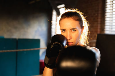 Young woman exercising in gym