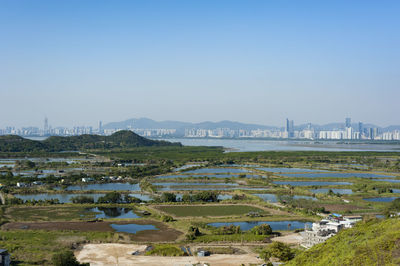 Aerial view of city against sky