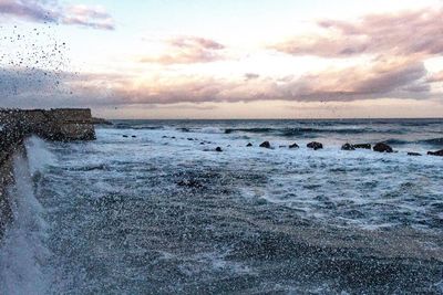 Scenic view of sea against sky during sunset