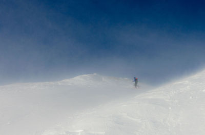 Scenic view of snow covered mountain against sky