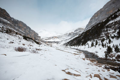 Scenic view of snowcapped mountains against sky