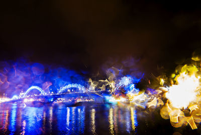 View of illuminated city lit up at night
