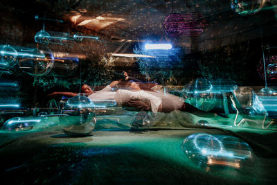 Digital composite image of woman swimming in pool