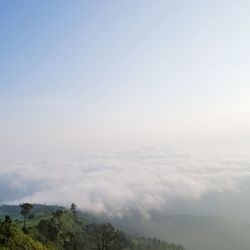 Scenic view of mountains against cloudy sky