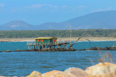 Scenic view of sea against mountains