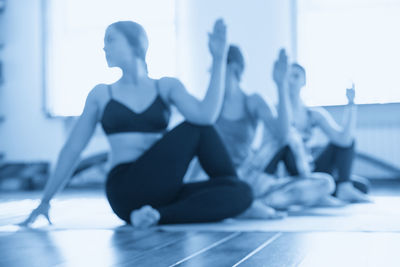 Low section of woman exercising at home