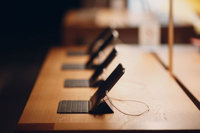 Close-up of laptops on table