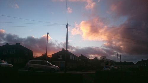 Cloudy sky above city at sunset