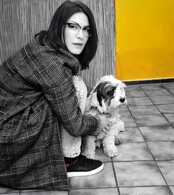 Portrait of young woman with dog