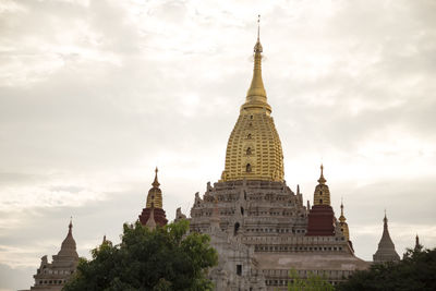 Golden tower of the ananda temple in old bagan, during golden sunset