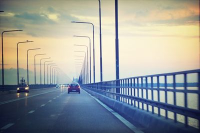 Cars on road against sky