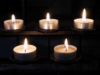 Close-up of lit tea light candles